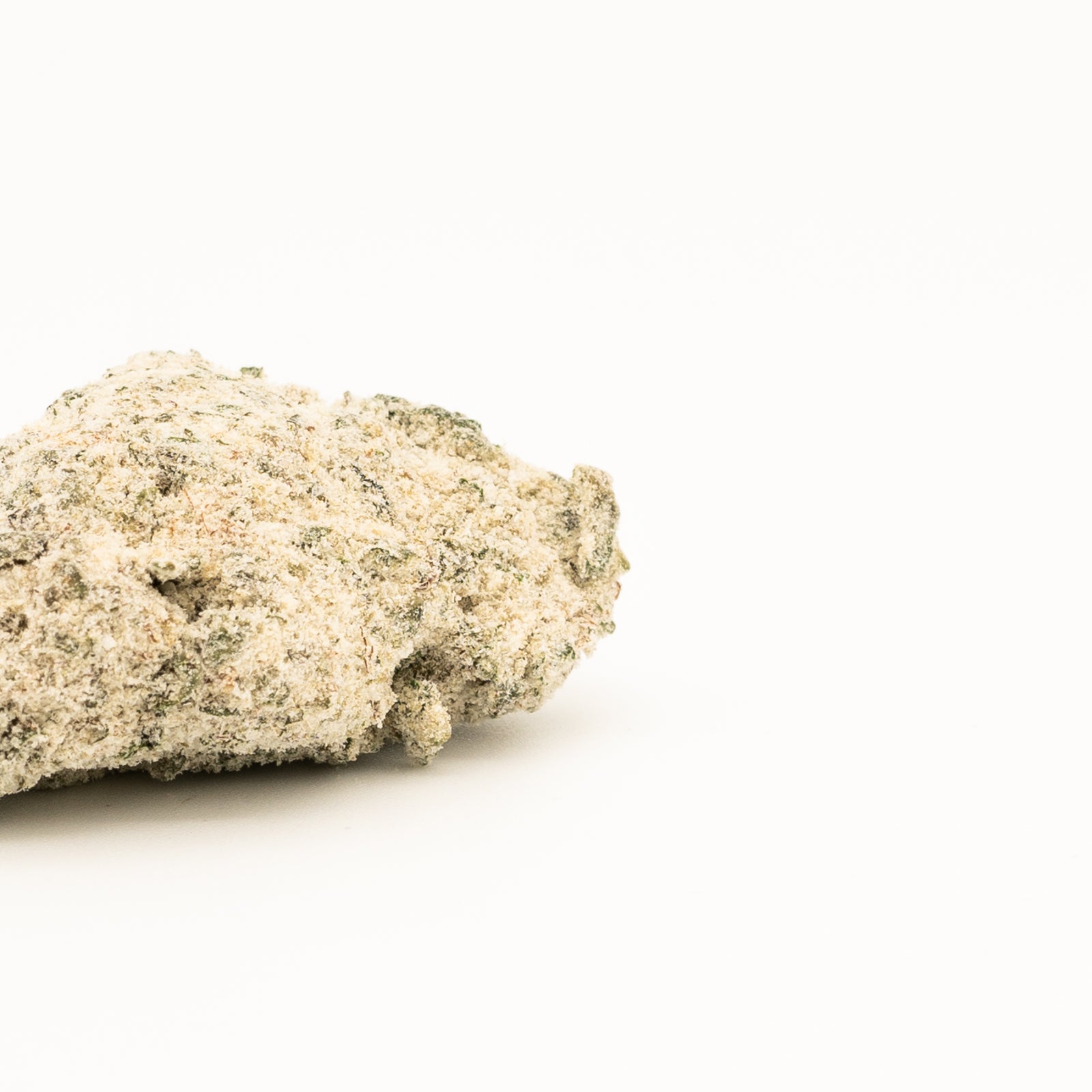 Rough pale beige mineral specimen for Bubba Kush Snow Caps CBD hemp flower product