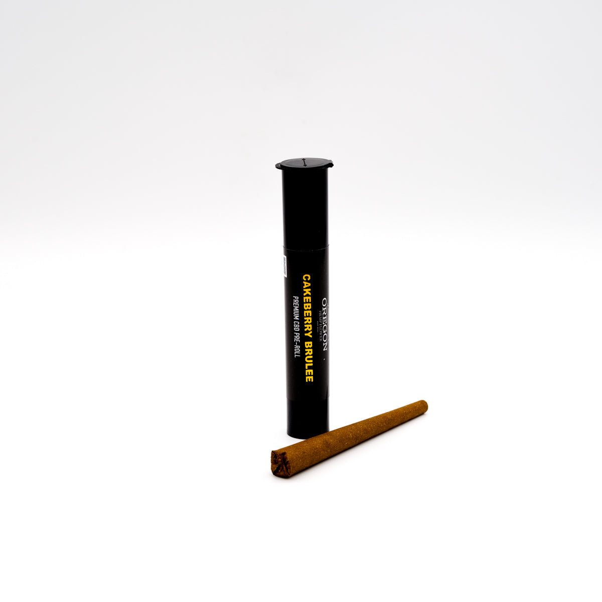 Black plastic tube with yellow text next to a brown cigar for Cakeberry Brulee CBD Flower