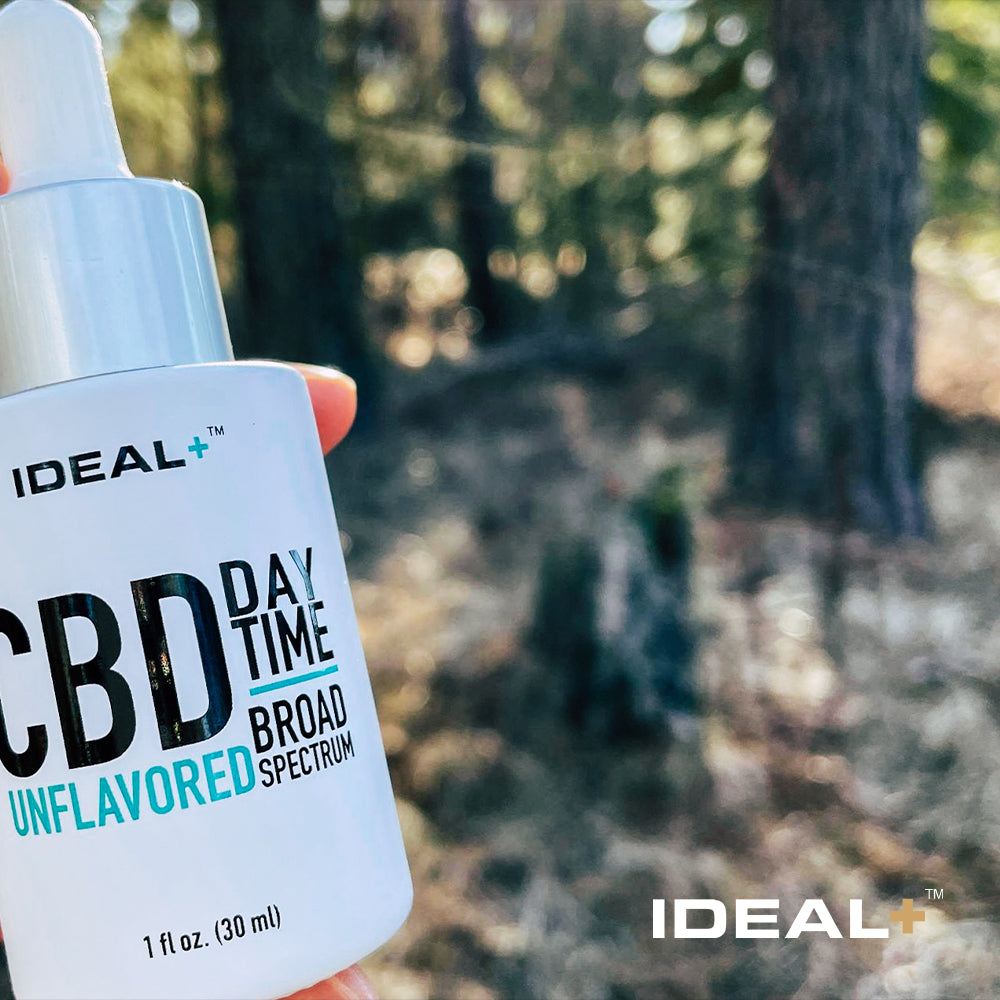 White bottle of IDEAL Tincture Oil Day Drops 1000mg CBD for daily wellness