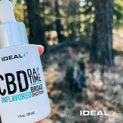 White bottle of IDEAL Tincture Oil Day Drops 1000mg CBD for daily wellness