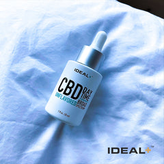 Light blue CBD tincture oil dropper bottle 500mg CBD with silver cap and black text