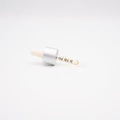 White and silver lip balm tube with Korean text for Tincture Oil Day Drops 1000mg CBD
