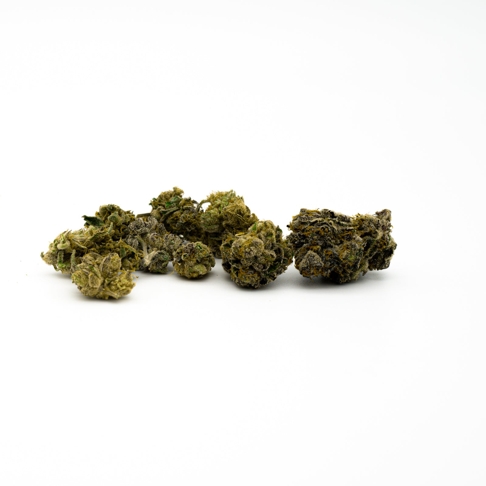 Several dried Obama Kush THCA flower buds arranged for optimal cerebral stimulation