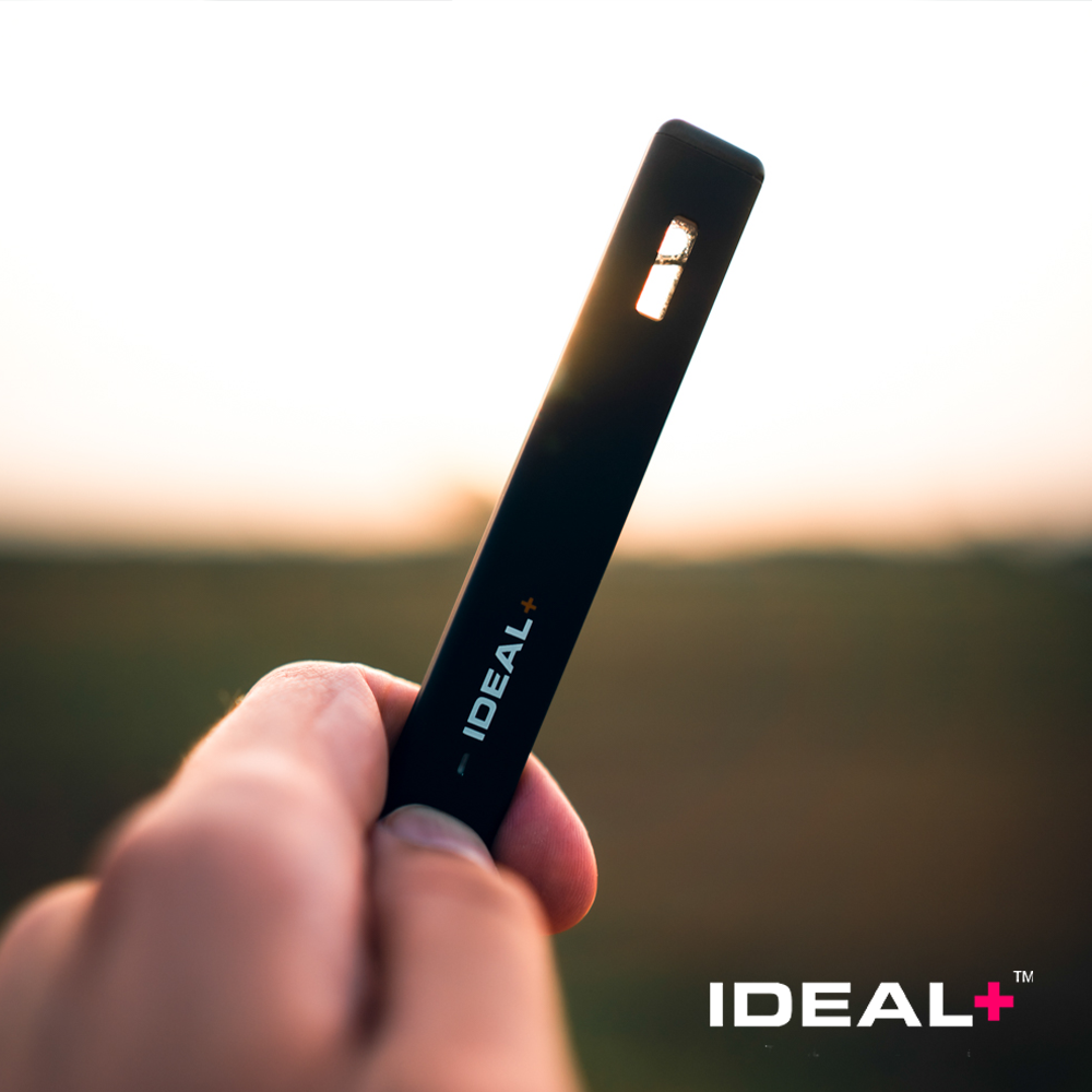 Black IDEAL+ Disposable Bubba Kush Vape 1200mg held in a hand showcasing its sleek design