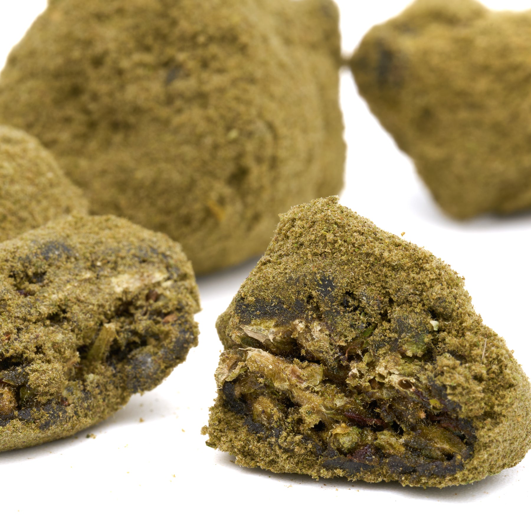 Bubba Kush Delta 8 Moon Rocks coated in green powder with dark chunks inside