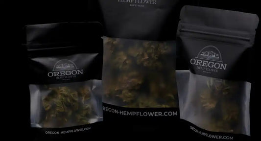 Several dark-colored pouches containing what appears to be hemp flower or cannabis products with ’Oregon’ branding.